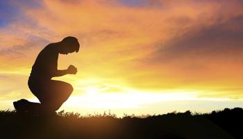 Praying at sunrise